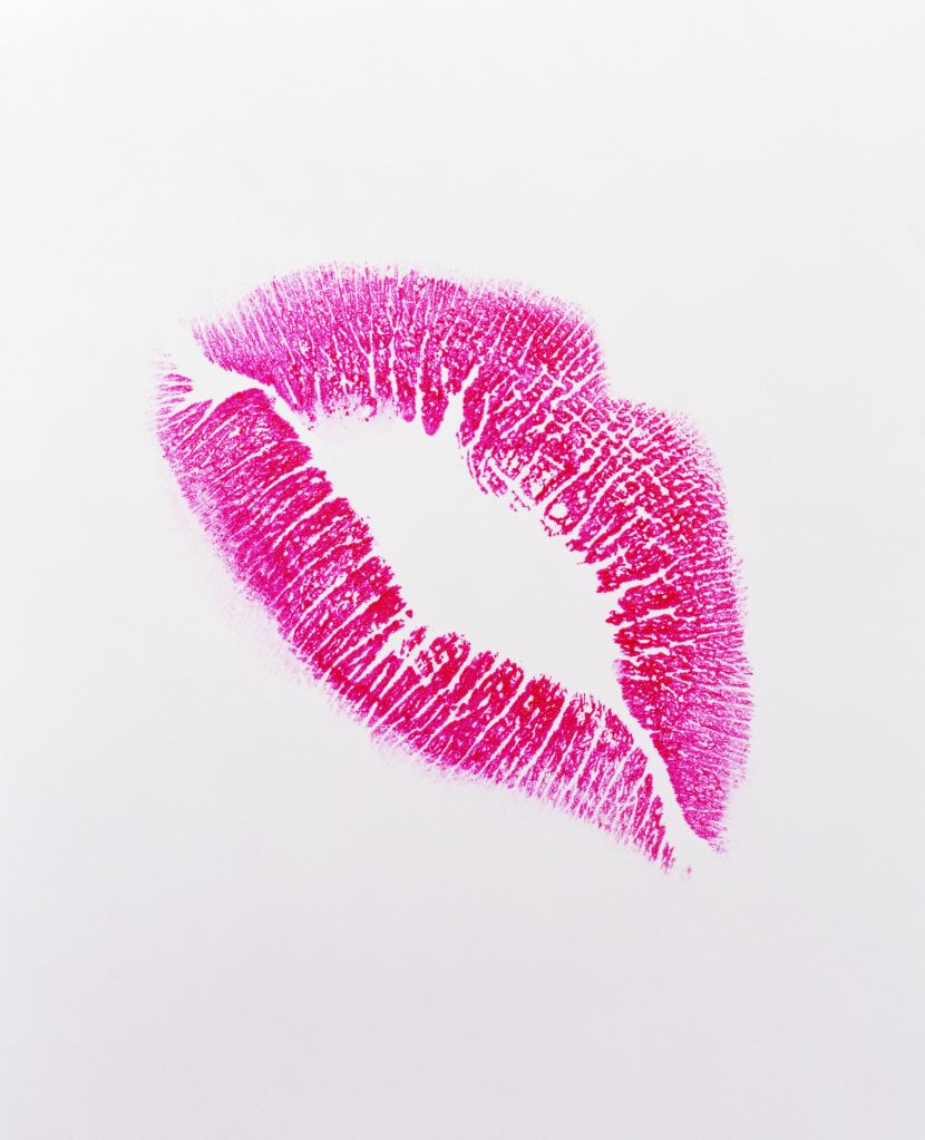 Lipstick kiss on white background, close-up