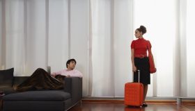Young Woman Preparing to Leave Man