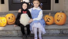Brother and Sister Dressed for Halloween Sitting on a Step, Toronto, Ontario