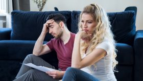 Young couple worried for taxes and family budget