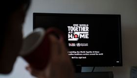 People Watch 'One World: Together At Home' In Hong Kong
